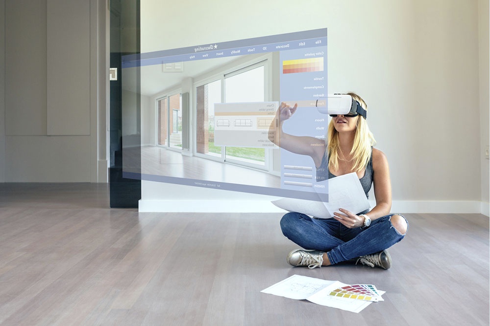 Женщина в VR шлеме планирует будущее пространство дома, ремонт и обстановку. VR и  AR  технологии.